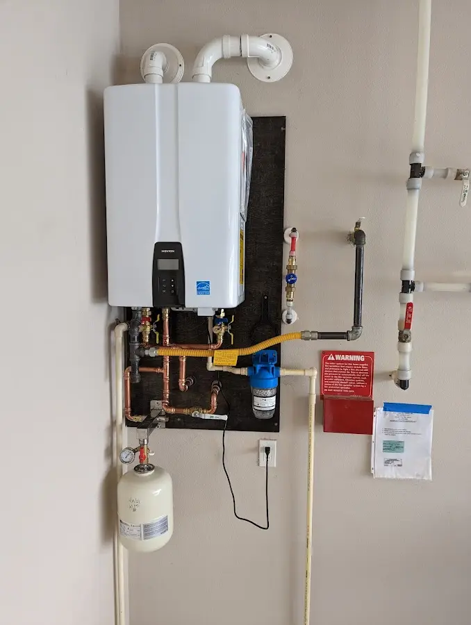 Professional plumber installing copper piping in a Spotswood home